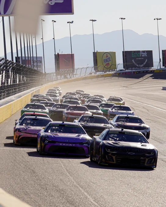 A pack of cars races down the backstretch in Las Vegas.