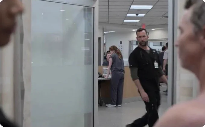 Dr Robby (Noah Wyle) peeks into a patient’s room on “The Pitt”