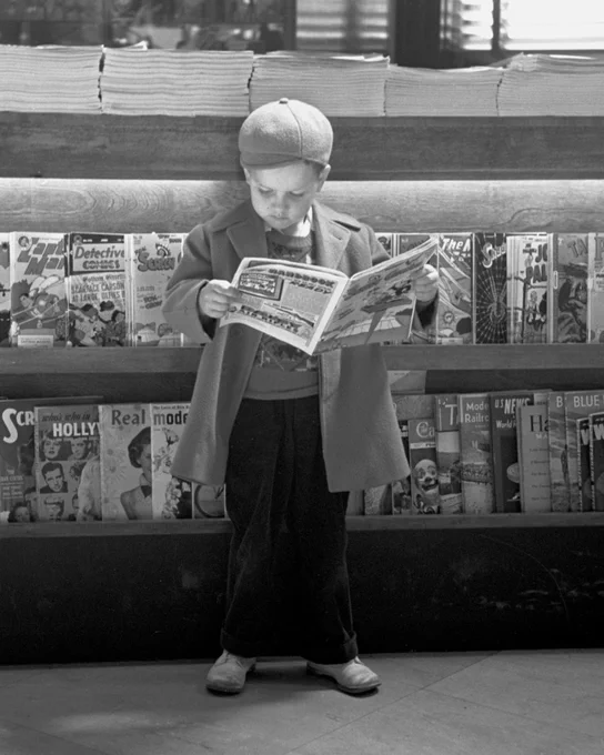 Boy reading comic book in Lincoln, Nebraska, 1948. From the CB&Q Company Records.