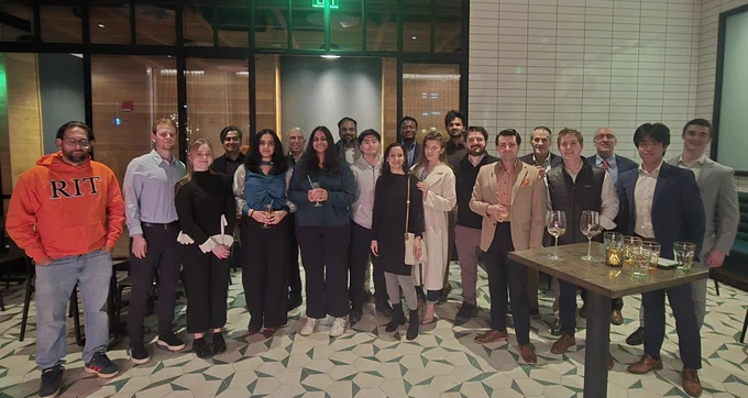 a group of people posing for a photo