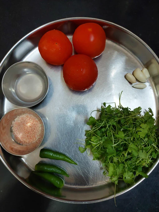  Ingredients - Tomatoes, Green Chillies, Corainder Leaves, Garlic pod, Pink Salt, and Lemon Juice. 