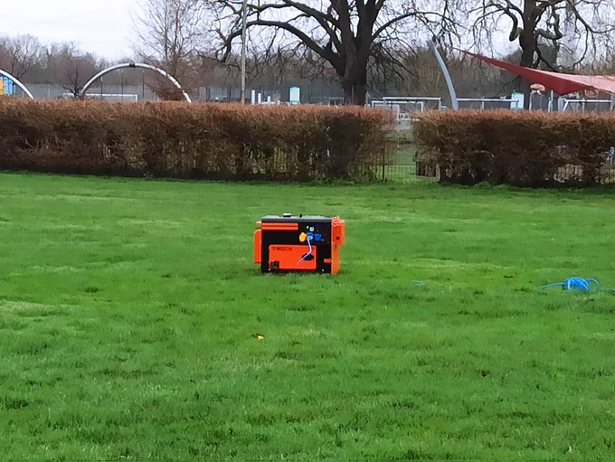 An orange and black generator has been set up near the kids play area in Beddington Park without any barriers, while burning fuel (probably diesel) and with noise too. The power lead connects to a burger van out of shot to the right, again no trip hazard precautions have been taken.
