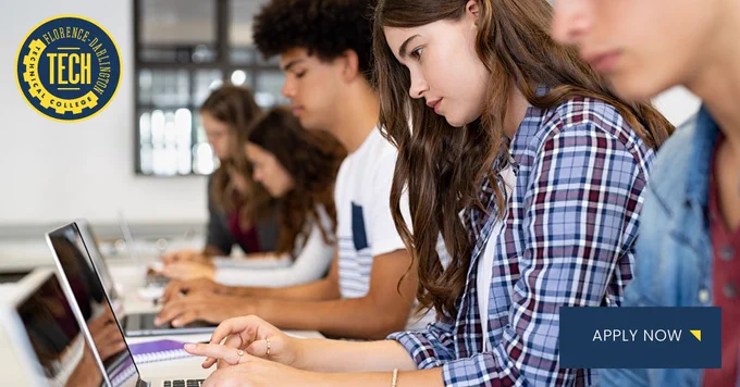 A group of students sitting at a desk, each focused on a laptop. The scene takes place in a classroom. The Florence-Darlington Technical College logo is visible in the corner, along with an "Apply Now" button.