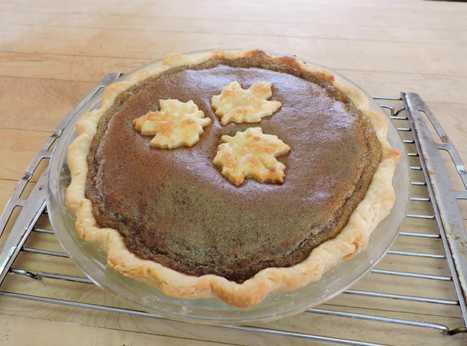 Maple sugar pie with maple leaf shaped pastry adornments 
