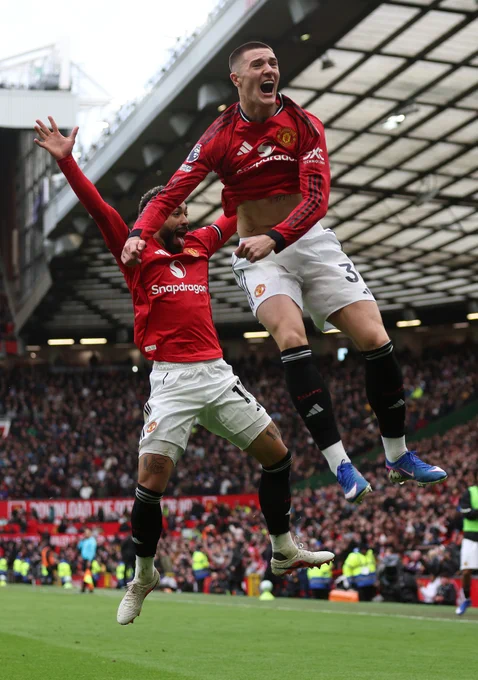Benjamin Šeško and Matheus Cunha leap for joy after United's third goal.