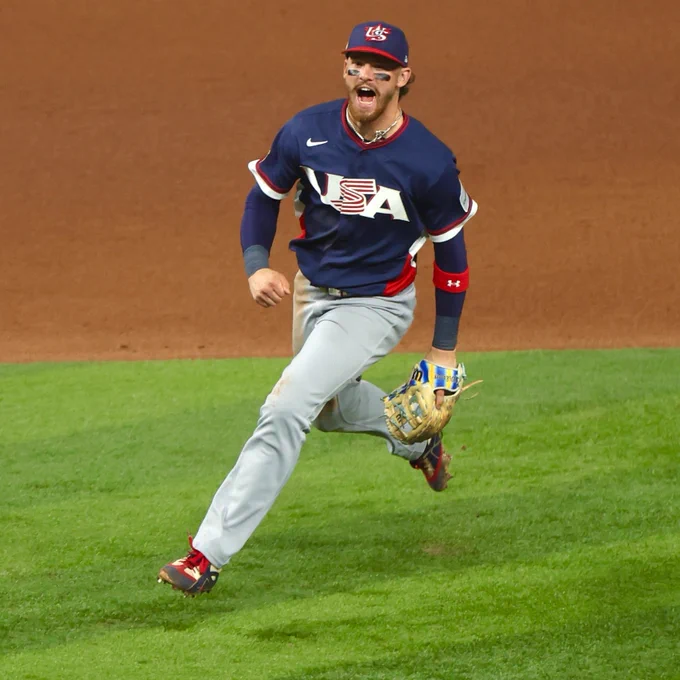 Bobby Witt Jr. smiles and pumps his fist after making a defensive play in the World Baseball Classic semifinals against Team Dominican Republic. He wears a Team USA uniform. (Photo: Gabriella Ricciardi/Major League Baseball)