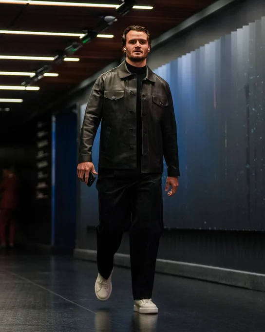 a photo of Seattle Kraken goaltender Joey Daccord walking into tonight's game in an all-black ensemble.