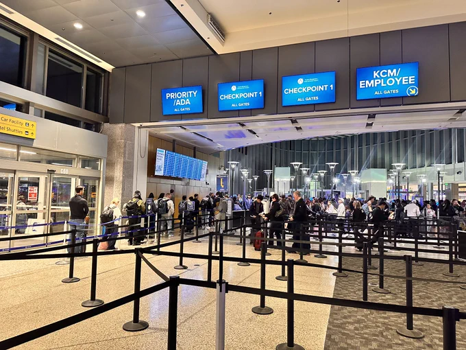 TSA checkpoint one at the Austin airport shows people waiting in line. The line is not too terribly long at all.