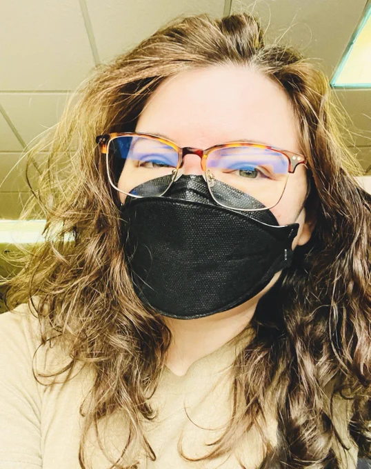 I'm wearing a black breatheteq headstrap kn95 mask and tortoiseshell and gold browline glasses.