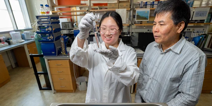Jena Choi, a UWM freshwater sciences major, works alongside faculty mentor Laodong Guo to analyze the chemical properties of wastewater that collects in oil fields.