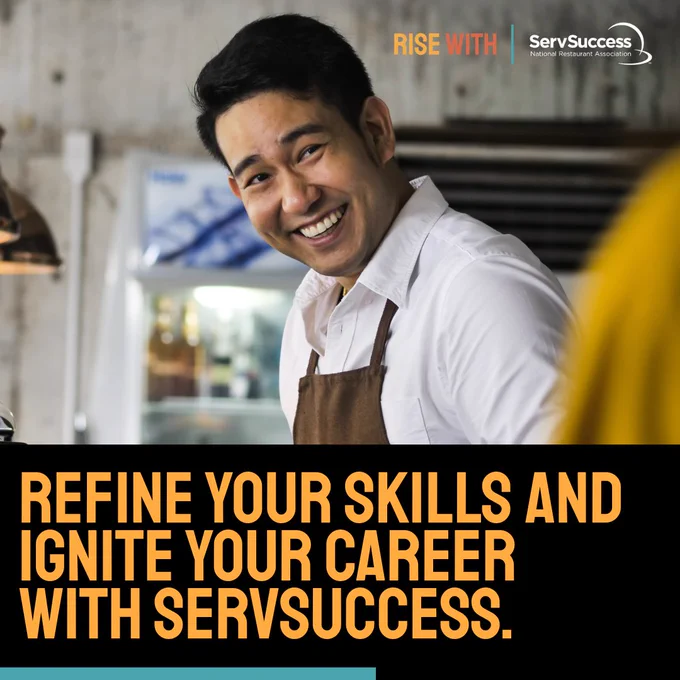 A person wearing an apron smiles while standing in what appears to be a cafe or kitchen setting. There is text reading, "Refine your skills and ignite your career with ServSuccess," along with the ServSuccess logo.