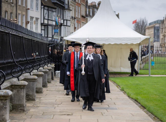 Chris Smith, Lord Smith of Finsbury, processes into the Senate-House