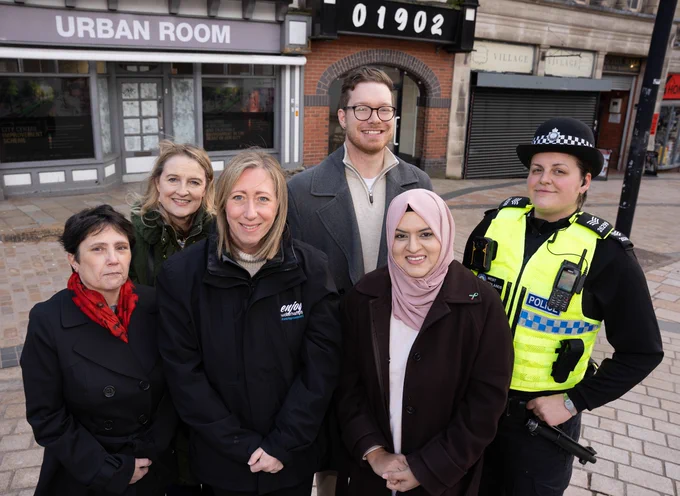 Promoting the new safety measures to deliver even better nights out in Wolverhampton outside the location of the weekend Safe Haven are, left to right, Councillor Zee Russell, Chair of the City of Wolverhampton Council's Licensing Committee; Debra Craner, Section leader, Trading Standards; Cherry Shine, Enjoy Wolverhampton BID Managing Director; Councillor Chris Burden, Cabinet Member for City Development, Jobs and Skills; Councillor Obaida Ahmed, Cabinet Member for Health, Wellbeing and Community; and Temporary Sargeant Elena Macmillan, from Wolverhampton Police's City Centre Neighbourhood Team 1.