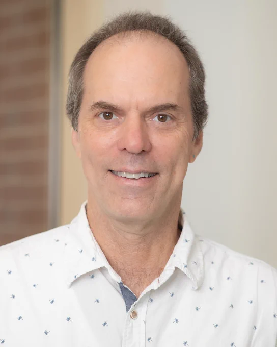 Headshot photo of Hank Bass.