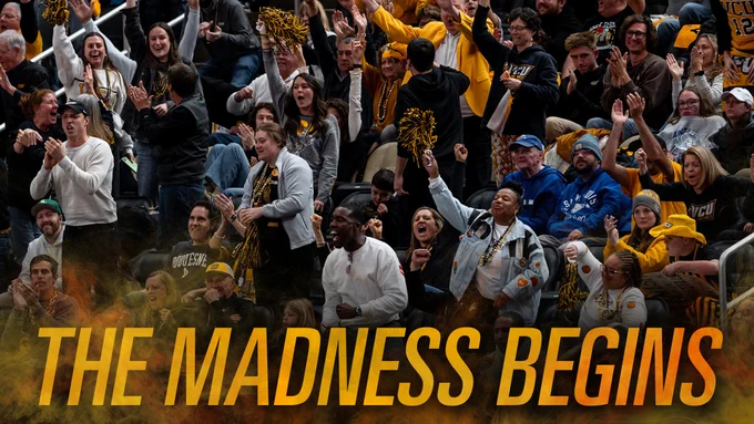 A crowd of enthusiastic sports fans is cheering in a stadium. Many are wearing team apparel and waving pom-poms. The text "THE MADNESS BEGINS" is prominently displayed across the bottom.