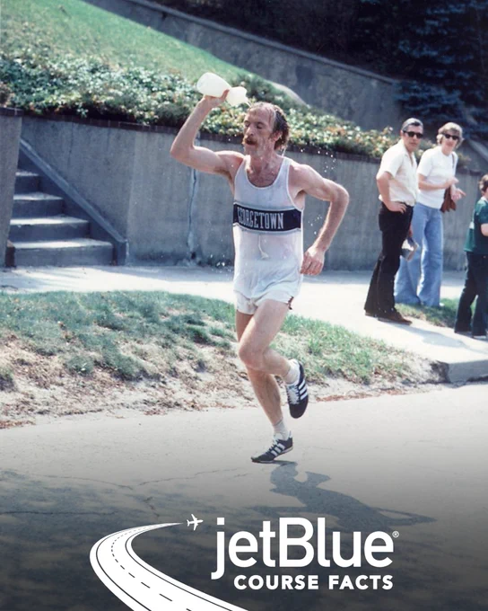 Image of Jack Fultz pouring a water bottle on his head while running the 1976 Boston Marathon
