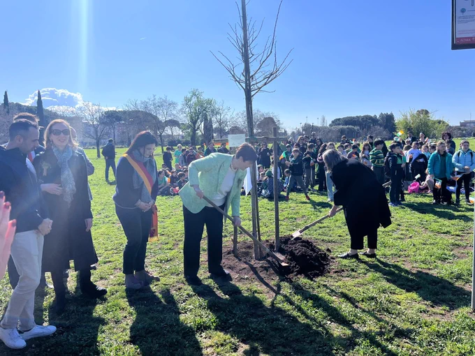 Minister Foley planting one of the trees