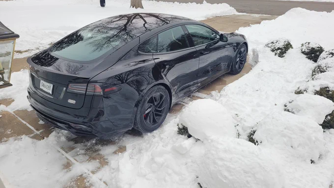 Black model s Plaid in the driveway where there used to just be floor mats waiting for the car's arrival. 