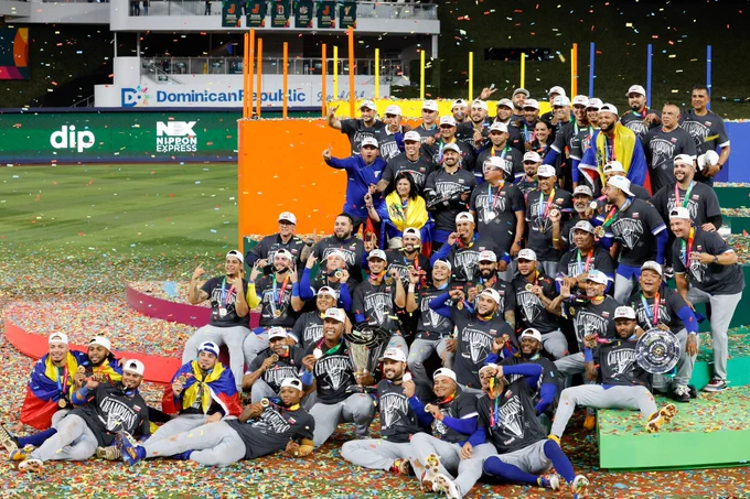Team Venezuela poses for photos while celebrating a World Baseball Classic title Tuesday night at loanDepot park.