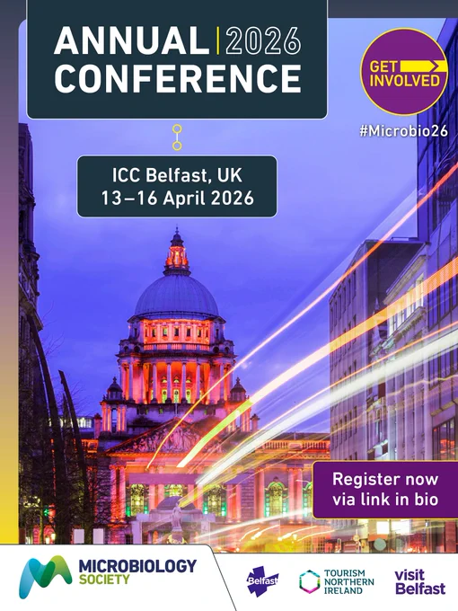 Night view of Belfast City Hall illuminated with colourful lights, promoting  registration for Annual Conference 2026 at ICC Belfast from April 13-16. 