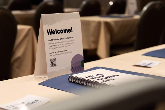 Table tent card welcoming attendees to the Annual Disability Statistics Conference. 