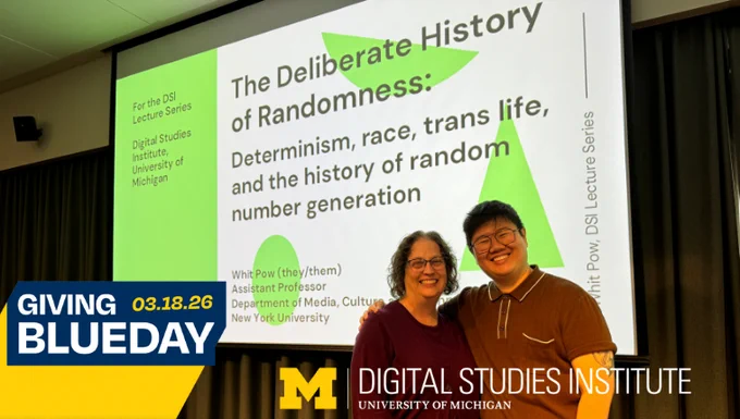 Photo of scholars Sheila Murphy and Whit Pow at the DSI Lecture Series. They are standing in front of screen with Whit Pow's lecture title in the background that reads, "The Deliberate History of Randomness: Determinism, race, trans life, and the history of random number generation."