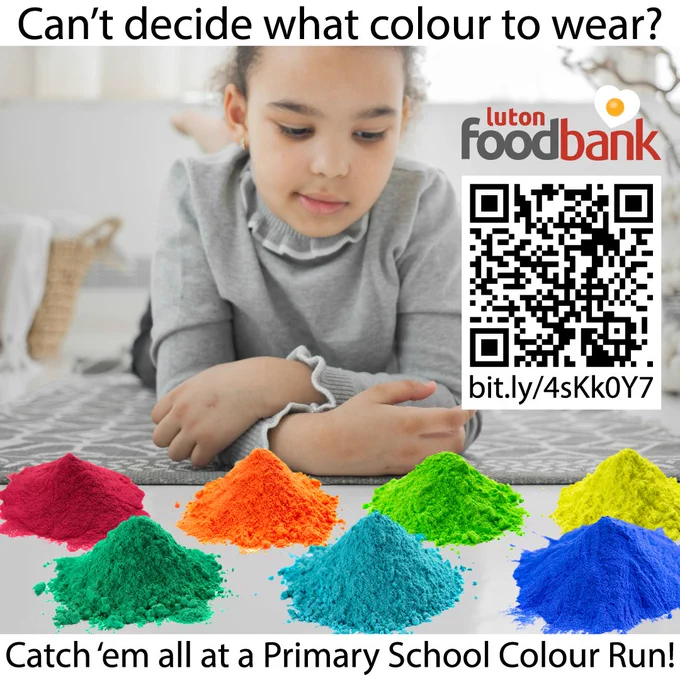 A young girl is photographed lying on a rug, and contemplating seven heaps of brightly coloured powder. Caption: "Can't deice what colour to wear? Catch 'em all at a Primary School Colour Run." Also featured, are the Luton Foodbank logo, and a QR code for the URL bit.ly/4sKk0Y7