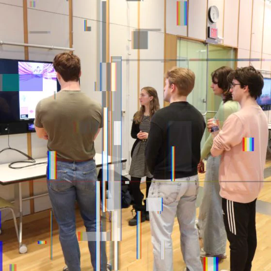 Students viewing a presentation at the Digital Studies AMPLIFY Student Showcase.