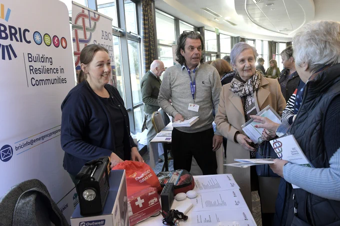 A group of people at one of the exhibition stands at the keep safe keep well events