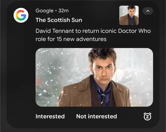 Image of an Android phone notification from the Scottish Sun titled "David Tennant to return (sic) iconic Doctor Who role for 15 new adventures." Below is a promotional picture of David Tennant in his role as Doctor Who. 