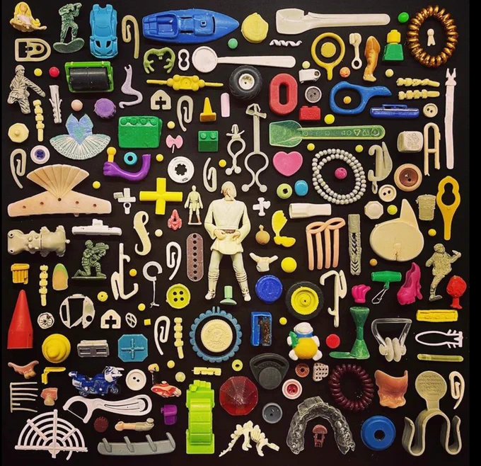 Miscellanous beach finds laid out on a black background