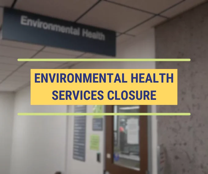 Sign about Environmental Health Services closure with a blurred image of the front desk that will be closed in the background.