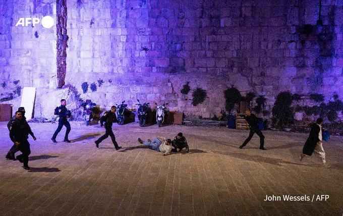 Israeli security forces violently disperse Muslim worshippers who were performing the nightly Tarawih prayers during the Muslim holy month of Ramadan outside the old city walls of Jerusalem on March 17, 2026