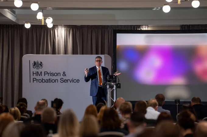 Lord Timpson giving a presentation and addressing the crowd at senior probation leaders forum.