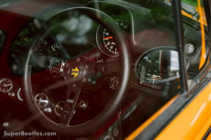 Custom touches done right. This 1303 Volkswagen Super Beetle interior blends classic air-cooled character with a performance feel, featuring a custom dash, added gauges, and a sport steering wheel. Vintage VW style with a driver-focused twist✌🏼