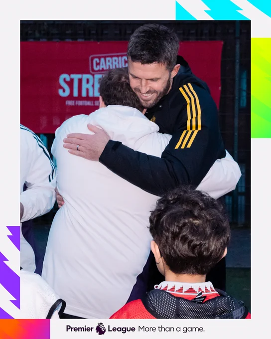 Michael Carrick and Mark Brent share a hug.