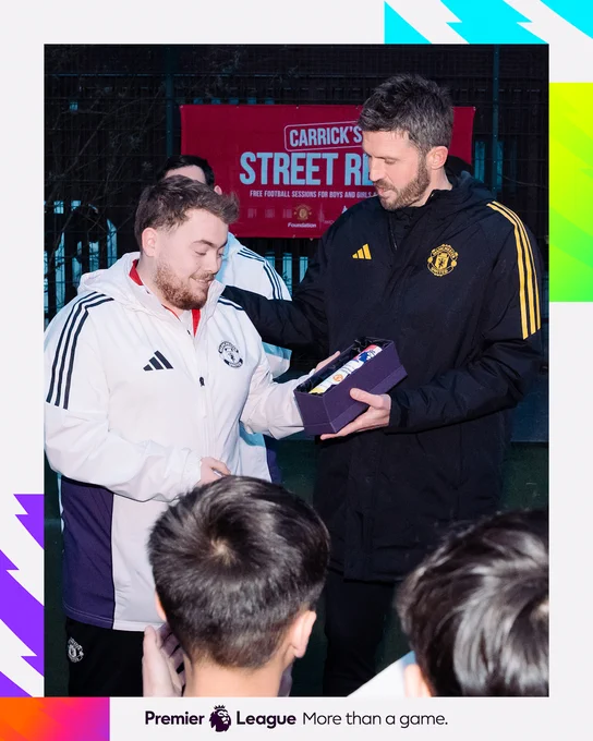 Michael Carrick presents the Community Captain trophy to Mark Brent.