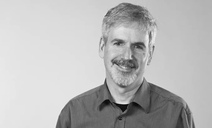 A man with grey hair and beard 