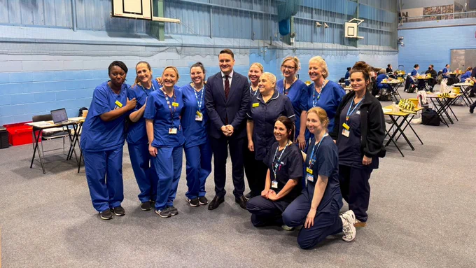 Wes with nurses at the vaccination centre at Kent University