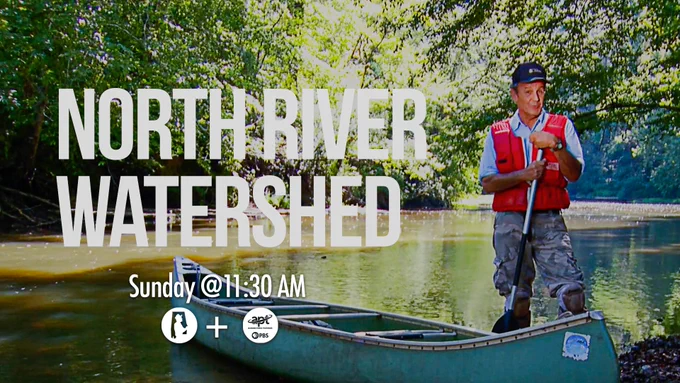 A person stands in a green canoe holding a paddle on a calm river surrounded by lush greenery. Text overlays the image, reading "North River Watershed," with "Sunday @ 11:30 AM" below. Logos of APT and PBS appear near the bottom.