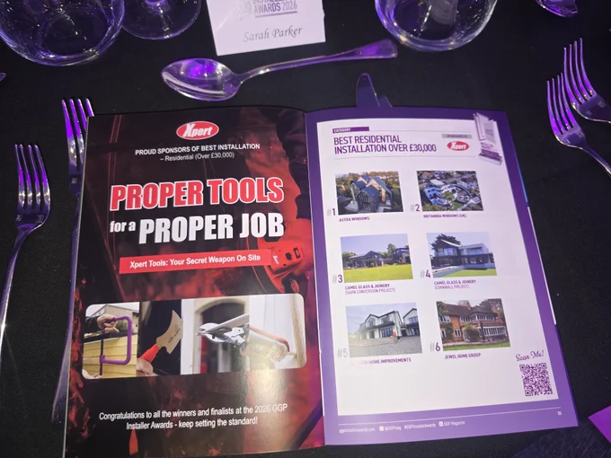 Open souvenir brochure at the GGP Installer Awards 2026 showcasing Xpert Tools advert as sponsors for best residential installation over £30,000 .