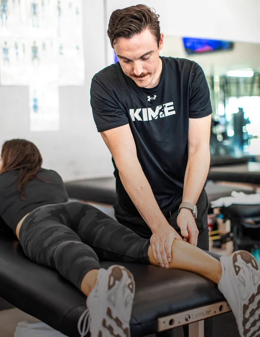 Niko Contos performing manual therapy