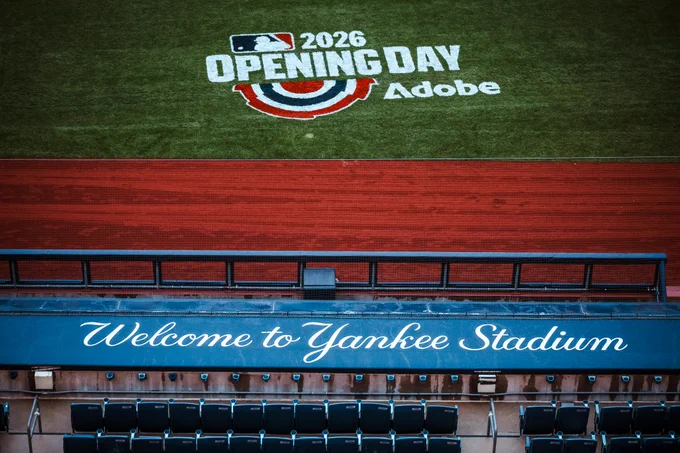 View of Yankee Stadium dugout and Opening Day logo on the field. 