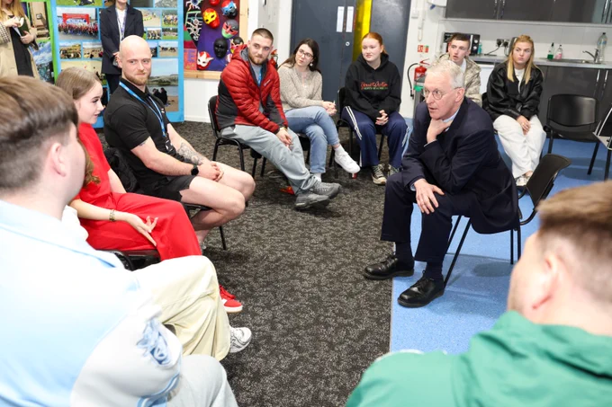 Secretary of State Hilary Benn with young people and staff from Springboard in Belfast.