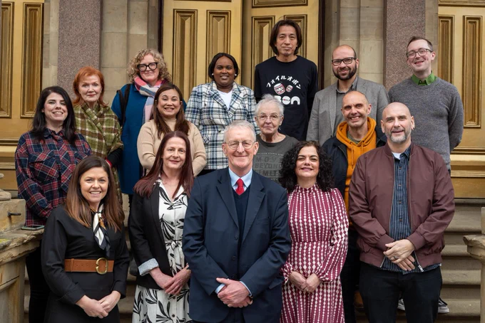 Secretary of State Hilary Benn with members of North West Community Network in Derry-Londonderry.