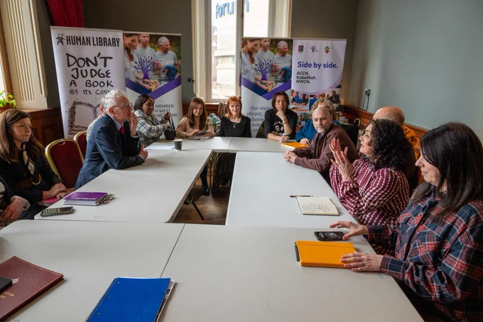 Secretary of State Hilary Benn with members of North West Community Network in Derry-Londonderry.