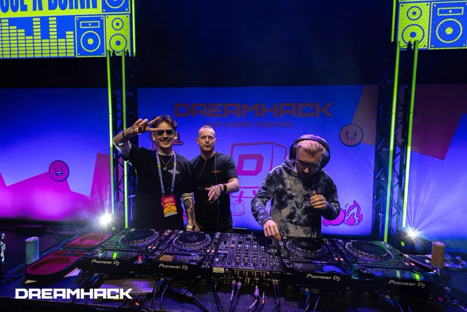 A photo of Moose, Haden and Djinn behind the decks at DreamHack.