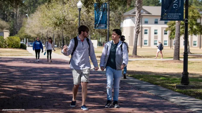 Two men walking on Charleston Southern University campus.