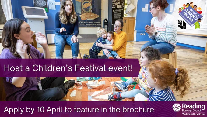 Adults and young children sit in a circle on the floor at a community venue, clapping and interacting during a children’s activity session. Overlaid text reads: ‘Host a Children’s Festival event! Apply by 10 April to feature in the brochure,’ with Reading Borough Council branding.