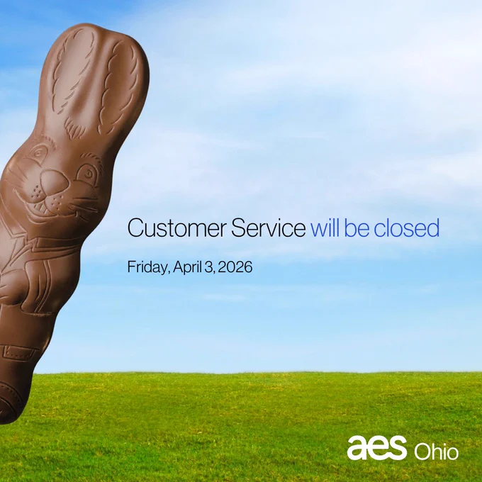 A chocolate bunny sits in a grassy field on a sunny day. Text reads "Customer Service will be closed Friday, April 3, 2026"
